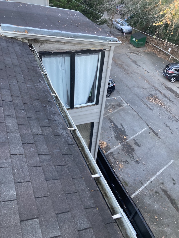 The same multi-unit property gutter cleared of leaves after cleaning